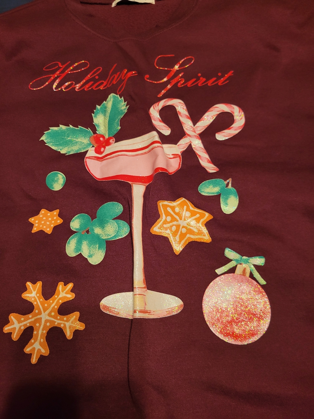 Wound Up Burgundy Holiday Spirit Graphic Sweatshirt